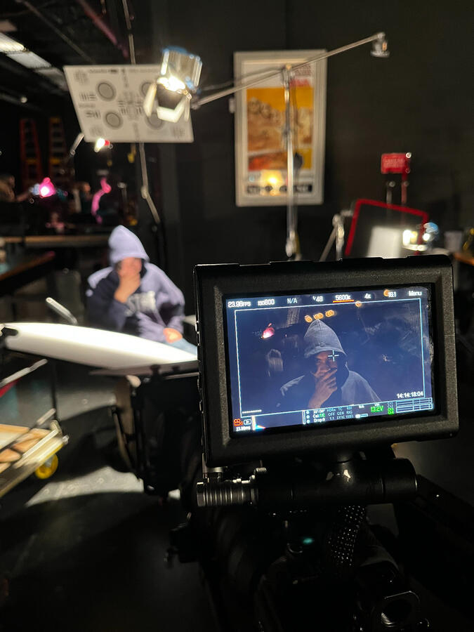 Students learning how make lighting and camera work together